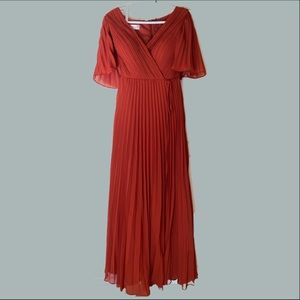 Beautiful rust colored JJ gown worn once. Very comfortable and elegant.